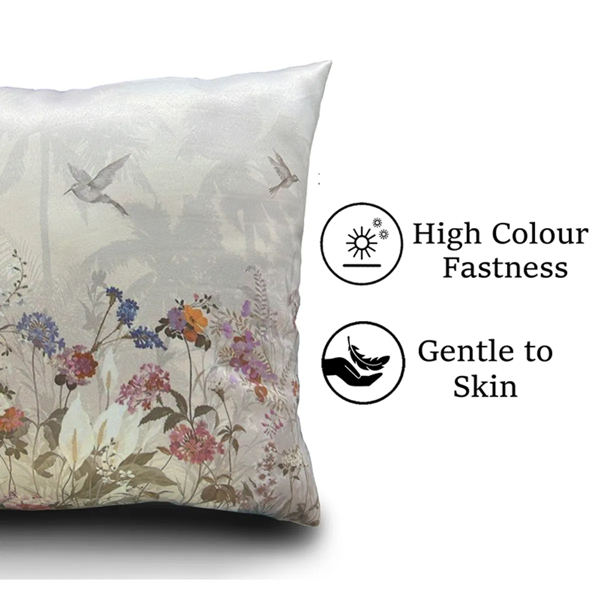Close-up of a pale floral cushion cover with delicate botanical detailing.