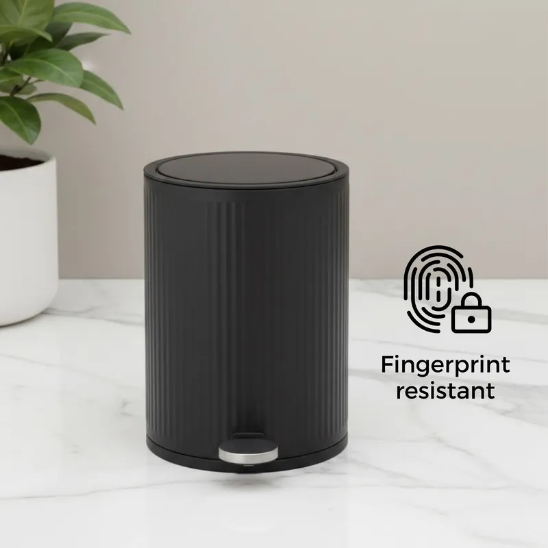 Black ribbed dustbin with closed lid and pedal front view