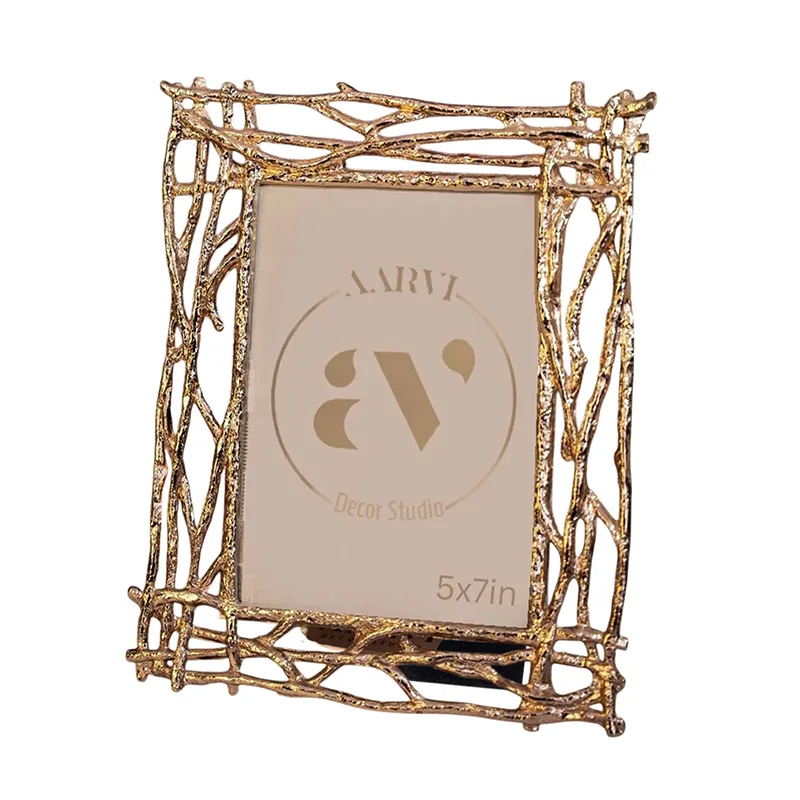 Angled view of the gold rectangular photo frame with branch-like detailing
