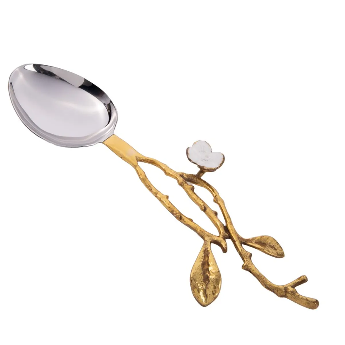 Close-up of a glossy silver salad spoon with a gold floral branch handle