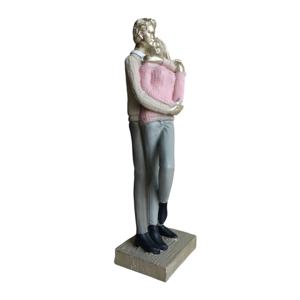 Side view of embracing couple figurine on a square decorative base