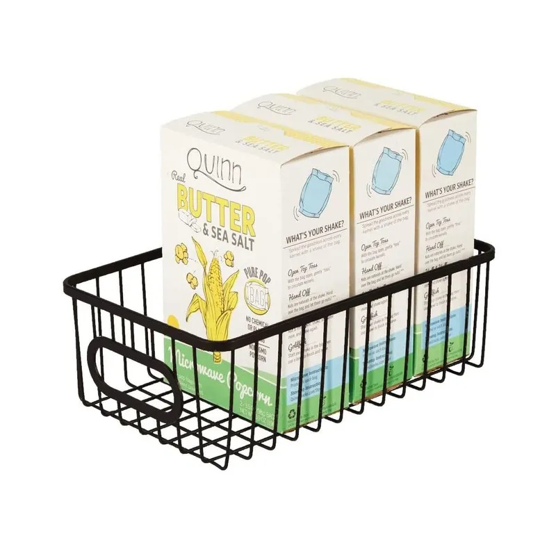 Black wire storage basket holding boxed pantry items