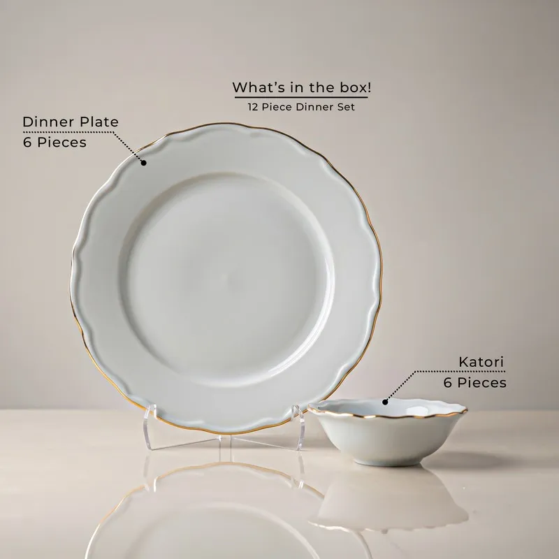 White dinner plate and bowl with gold rim shown together