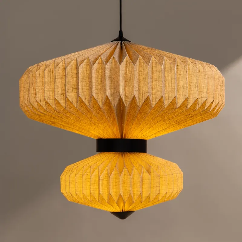 Front view of illuminated two-tier beige pendant ceiling lamp