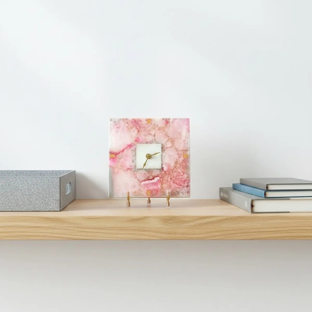 Pink square agate table clock displayed on a wooden wall shelf