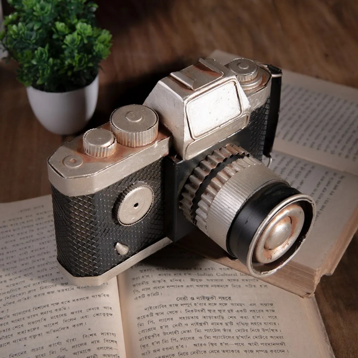 Close view of vintage camera showpiece with textured body and metallic lens detail