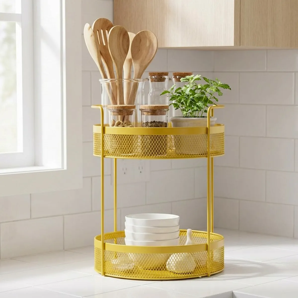 Yellow organiser holding wooden utensils, jars and a plant in a kitchen