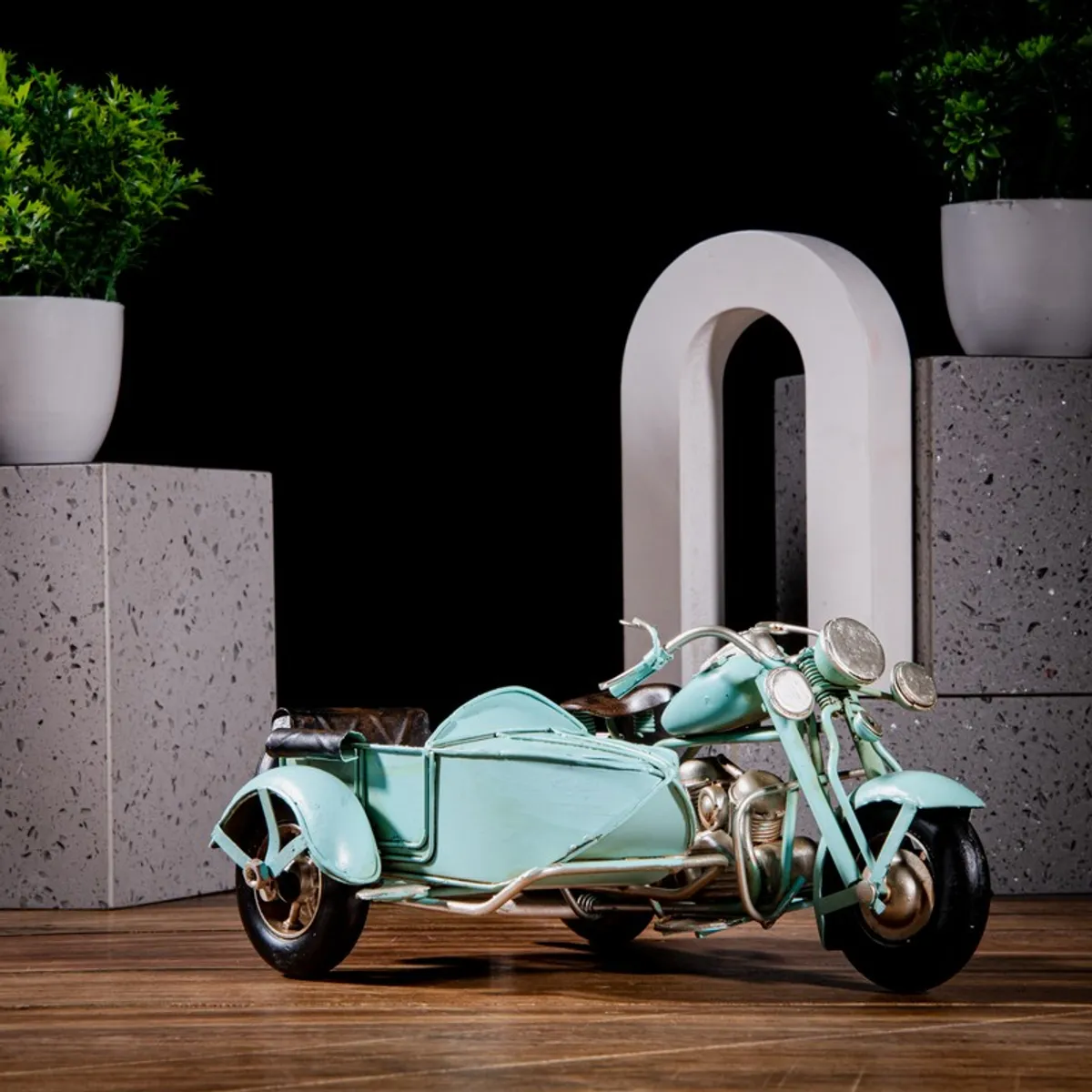 Blue retro motorcycle sidecar showpiece styled on a tabletop