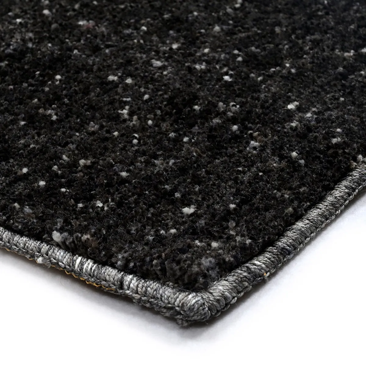Close-up of the black carpet corner and finished edge