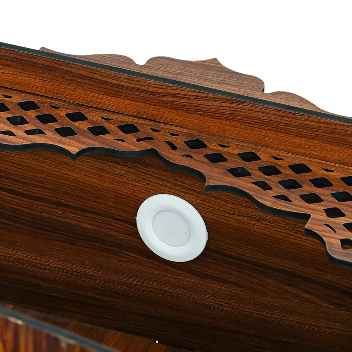 Close-up of the mandir top panel with round light fitting