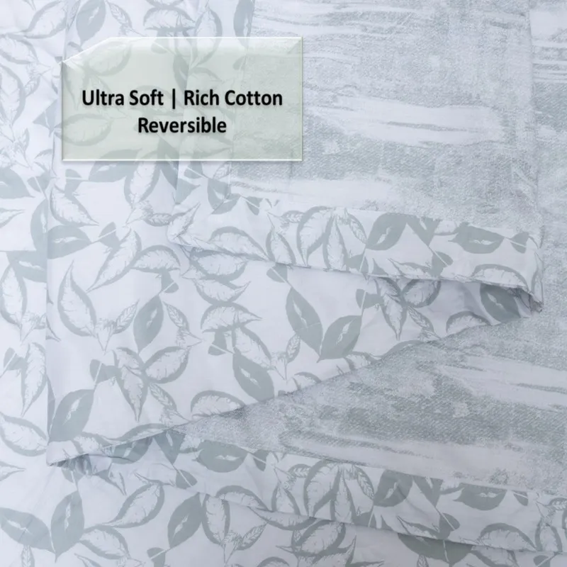 Close-up of the folded reversible dohar with leafy and abstract prints.