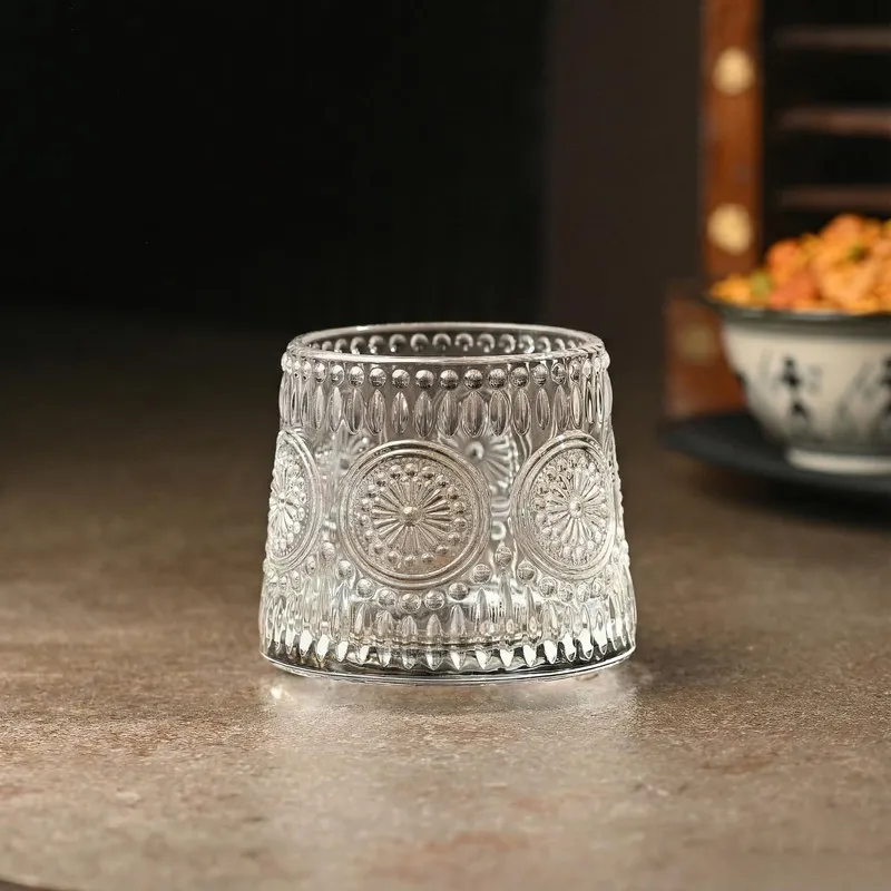 Single empty clear glass whiskey tumbler
