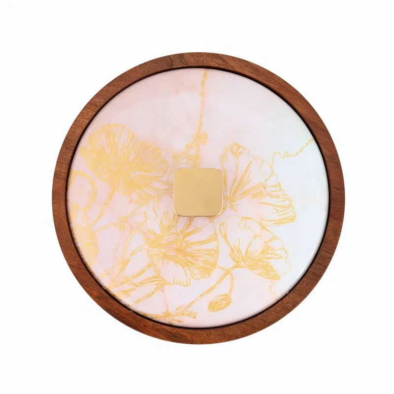 Top view of round masala box with cream floral lid and wooden rim