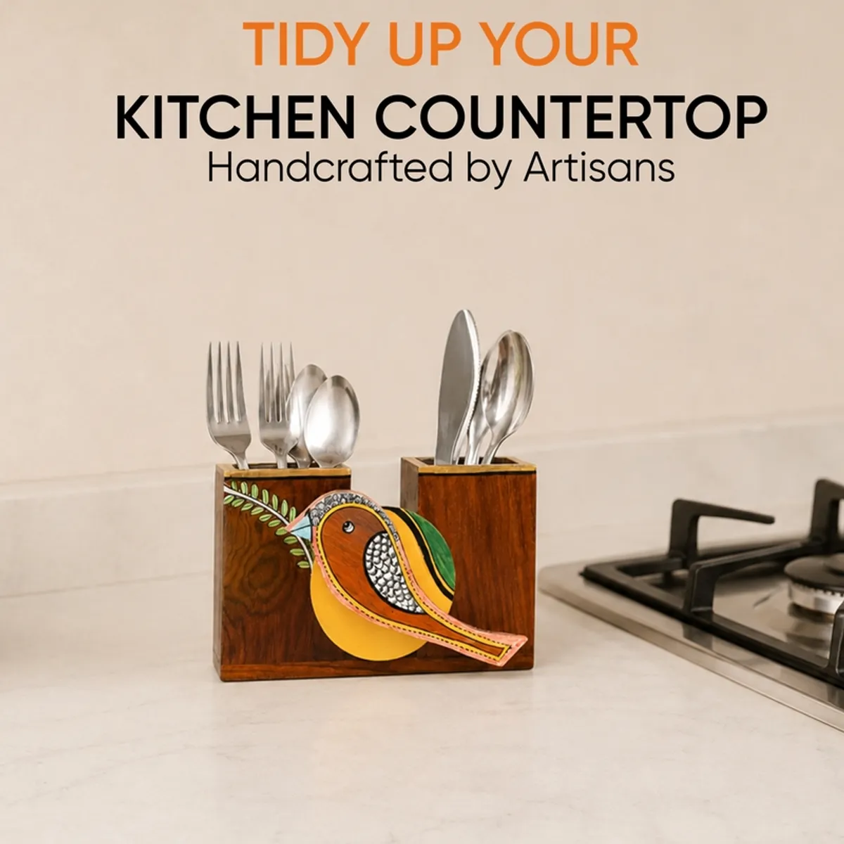 Sparrow cutlery holder shown on a kitchen counter beside a stovetop.
