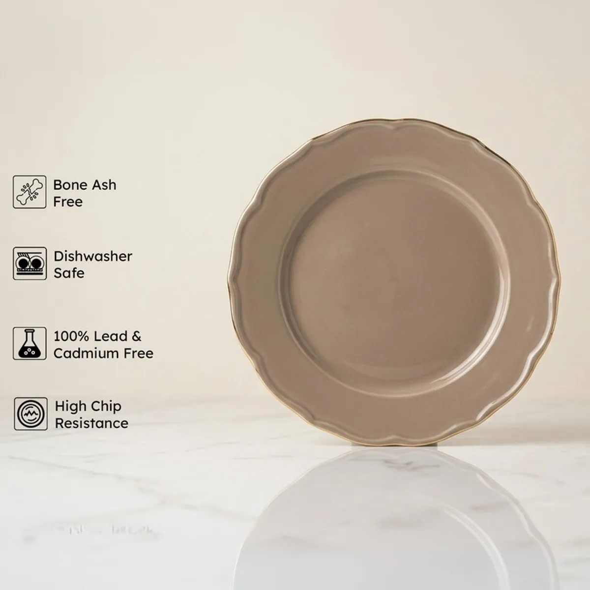 Single grey round plate with scalloped edge and gold rim