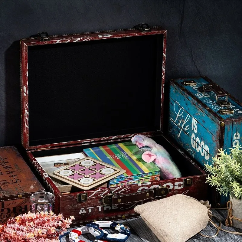 Open vintage-style storage box showing books and small items inside