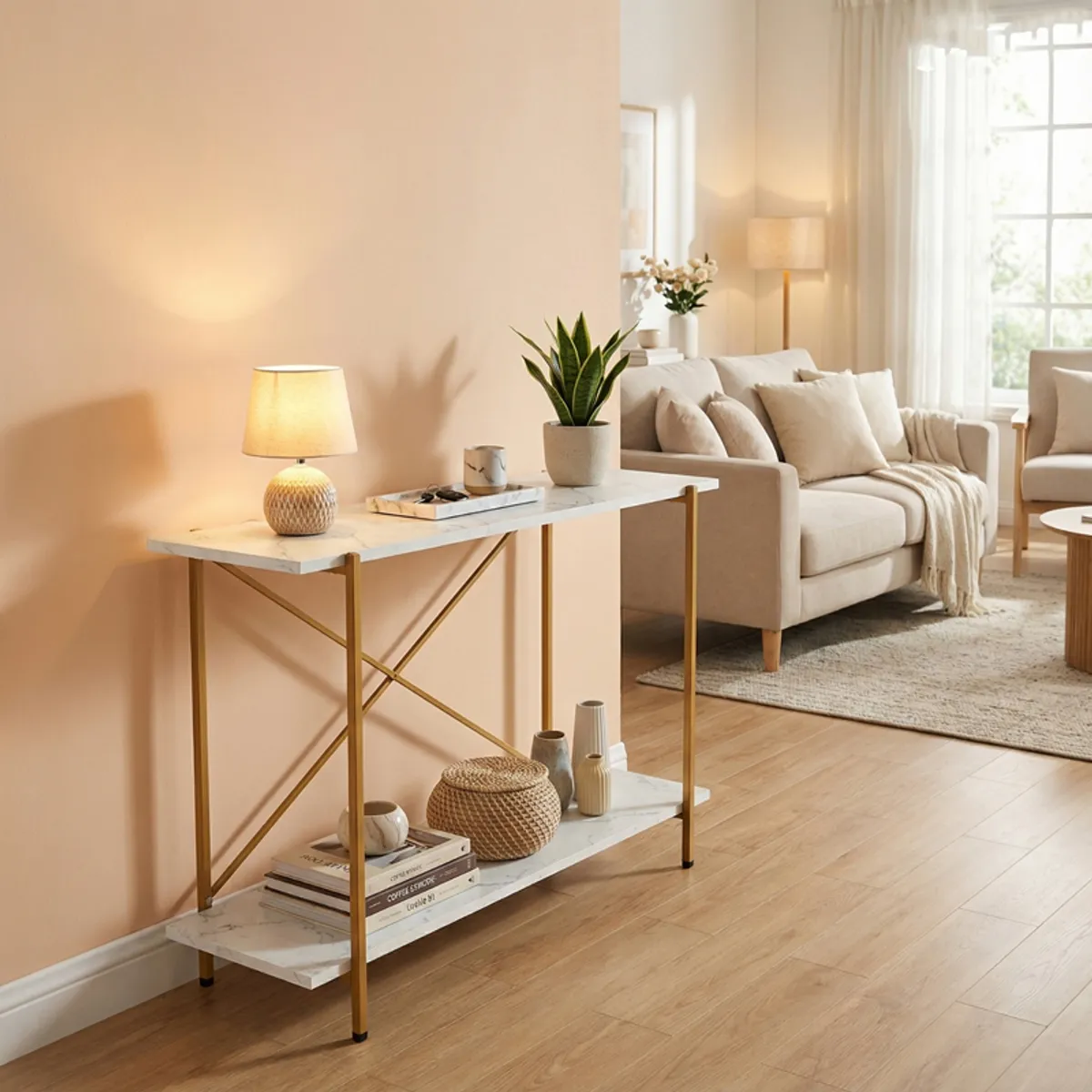 Slim white and gold console table with décor in a bright living room