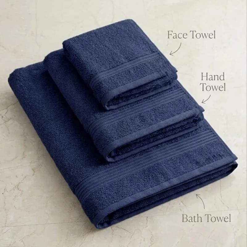 Folded navy bath, hand and face towels stacked together