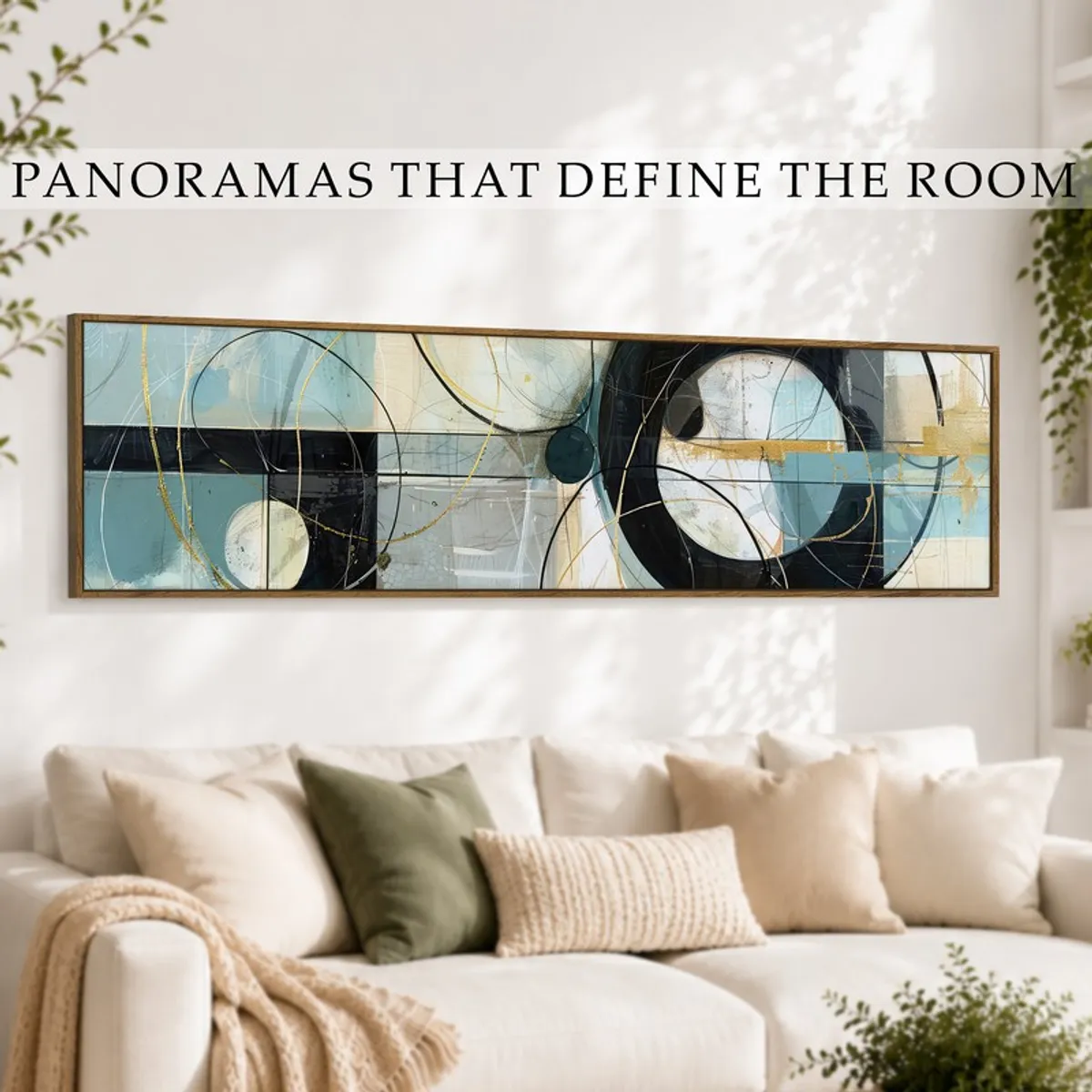 Long abstract wall art in blue, black and gold above a cream sofa