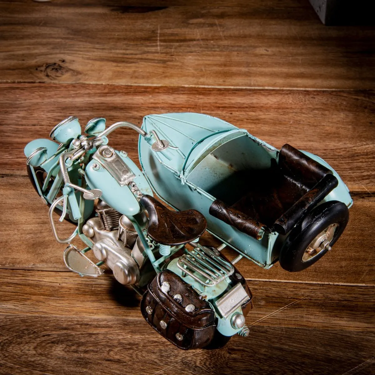 Top view of blue motorcycle sidecar showpiece with detailed seat and wheels