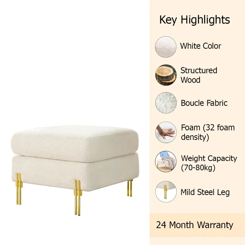 White bouclé ottoman shown with its gold legs and layered cushion design