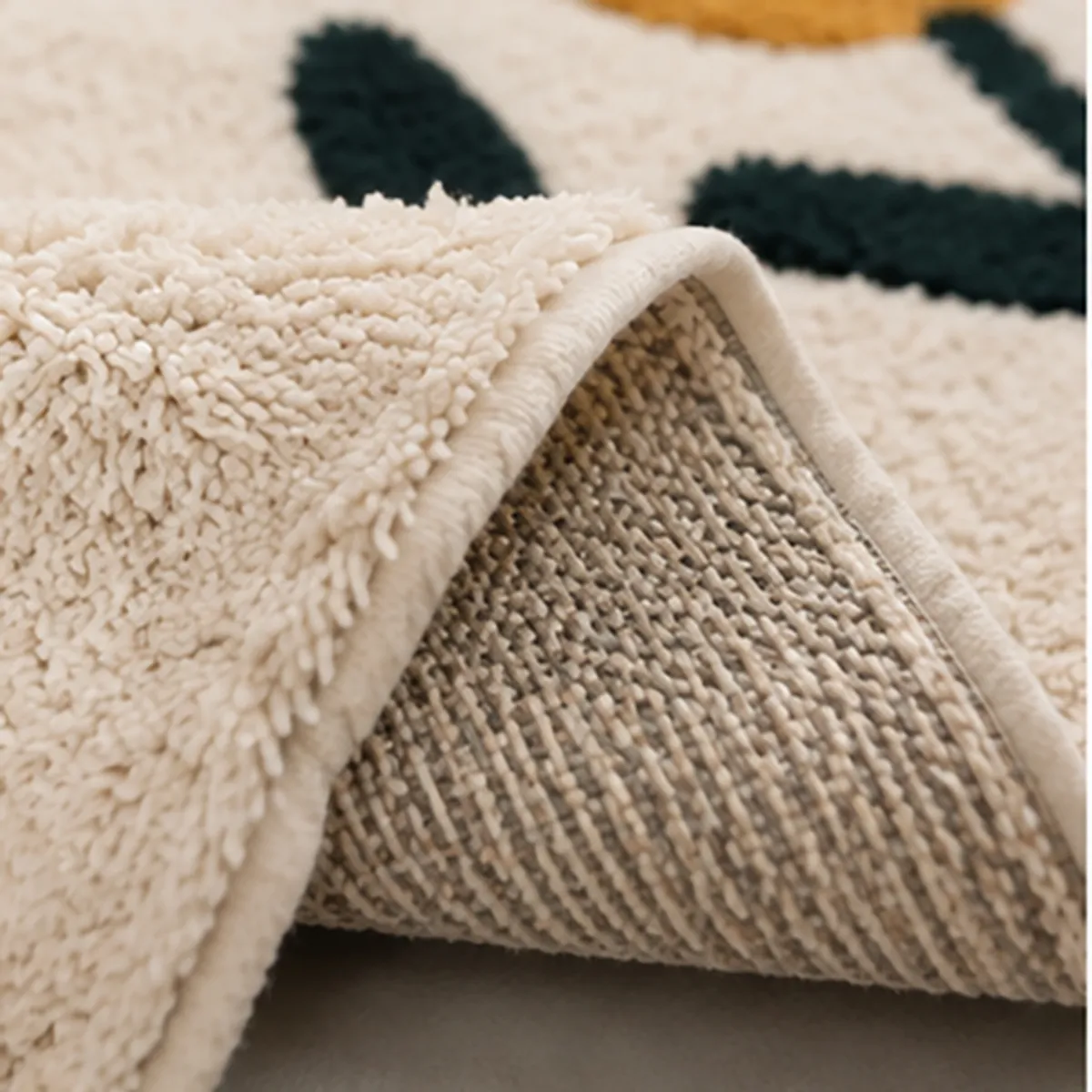 Folded corner showing the textured surface and anti-skid backing of the bath mat