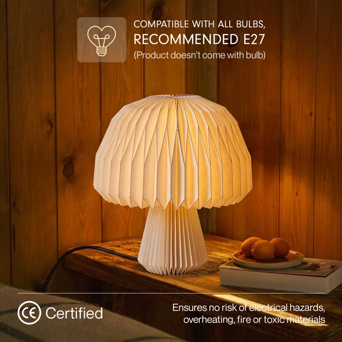 Close view of the lamp's pleated off-white shade glowing warmly