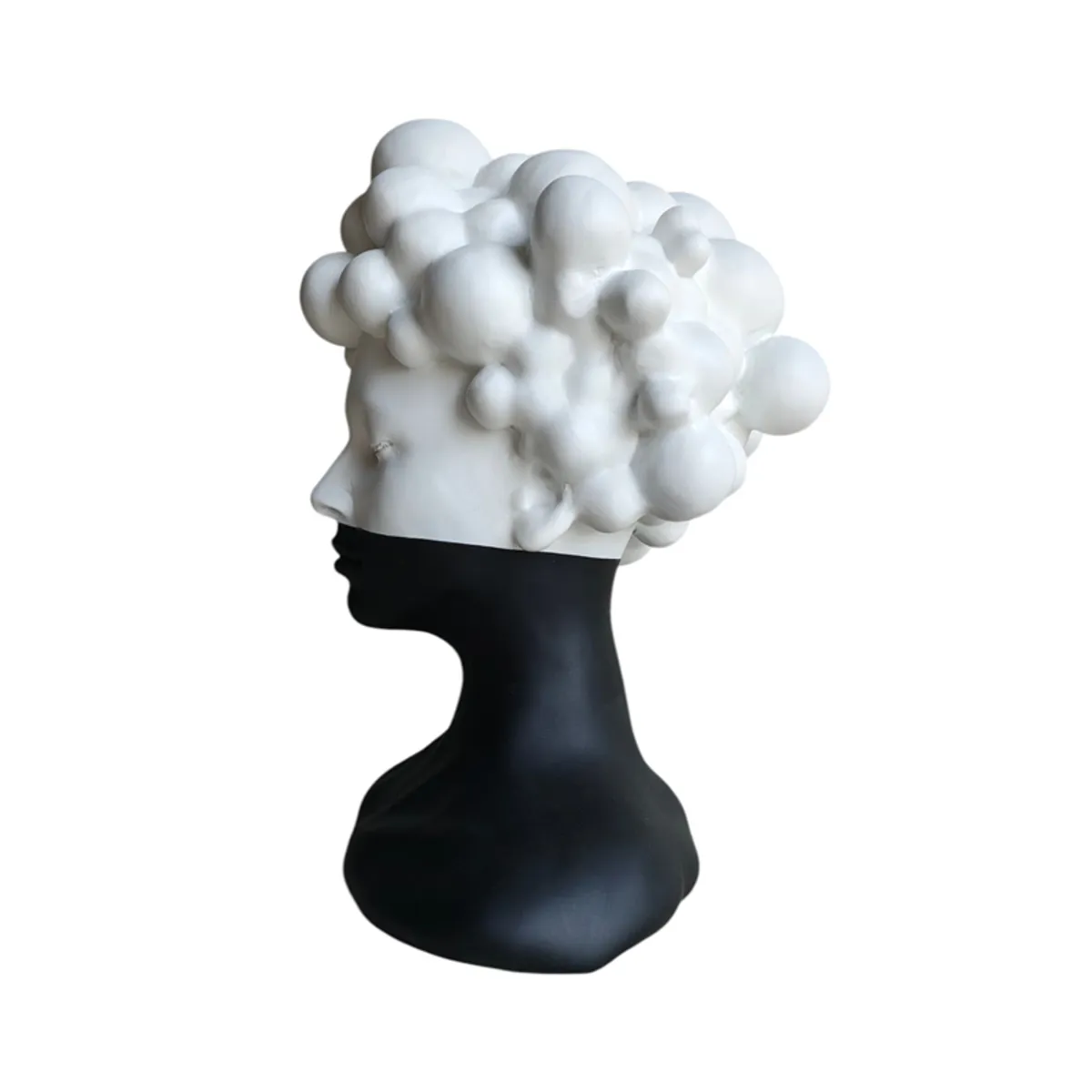 Side view showing the sculptural profile and rounded white bubble-like hair