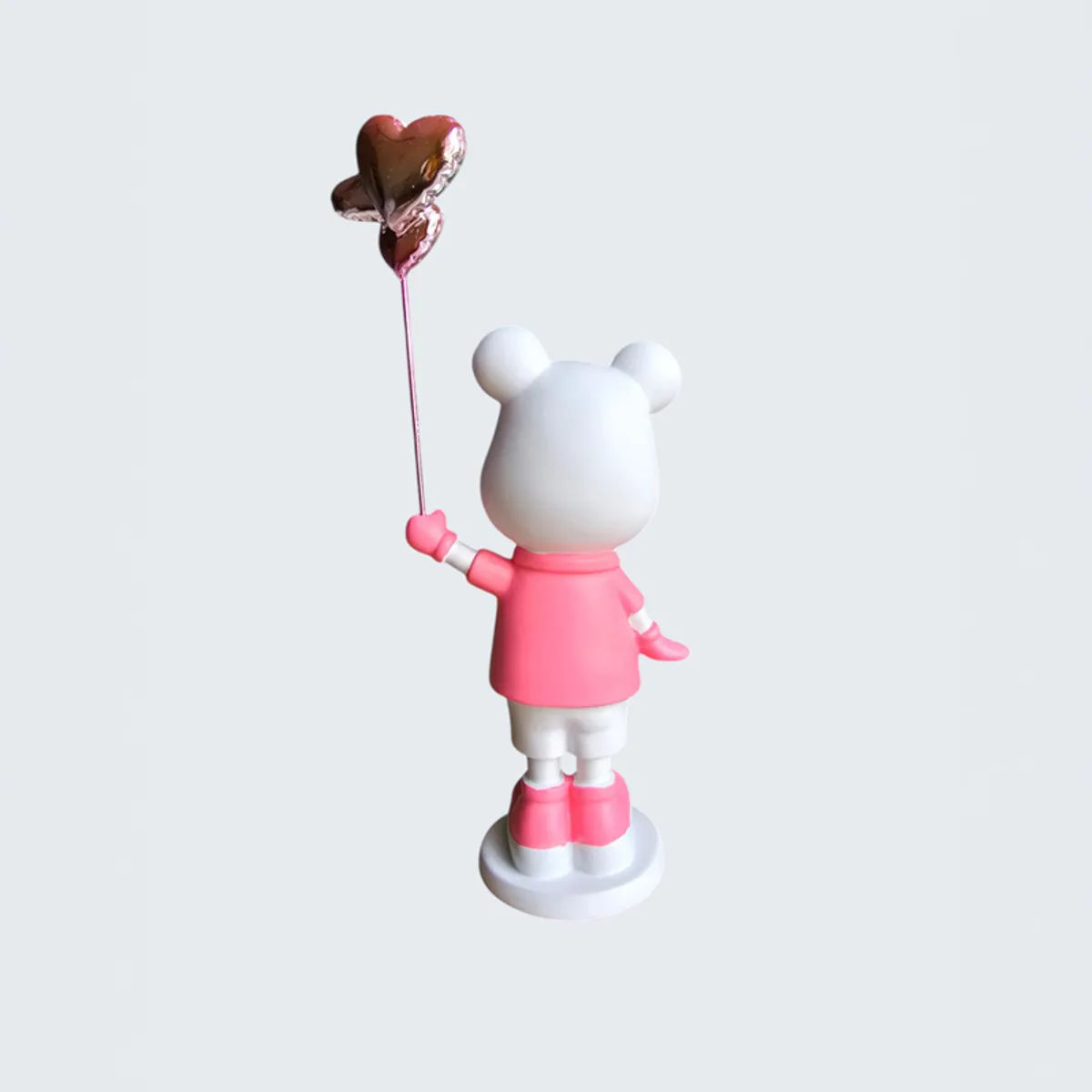 Back view of the pink and white bear showpiece with a heart balloon