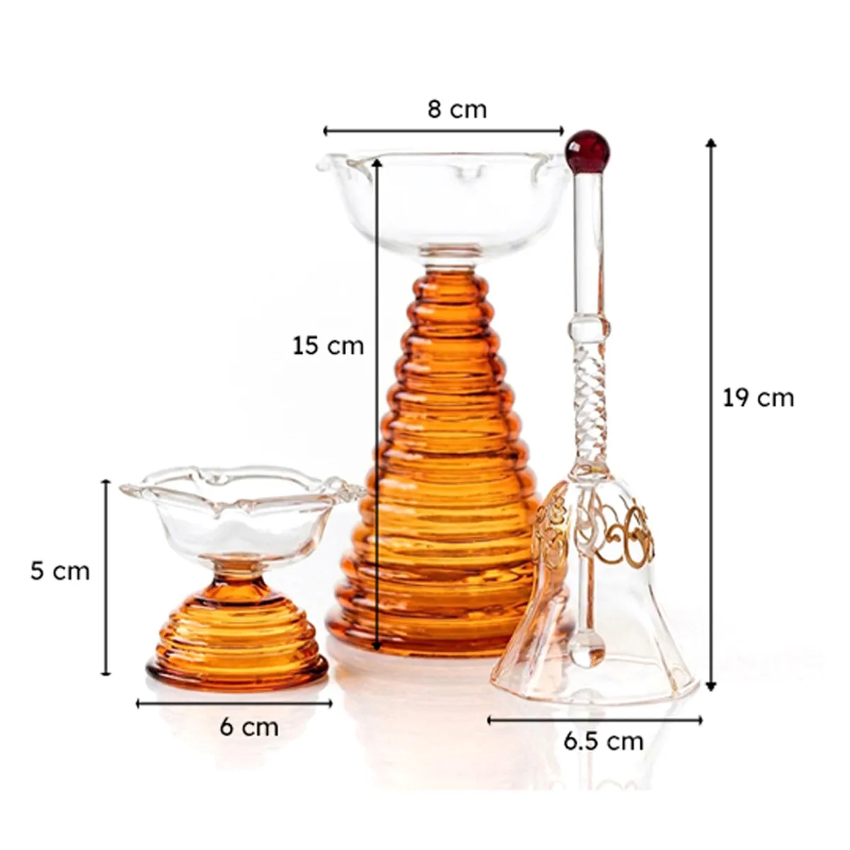 Glass pooja set showing the diya and bell measurements