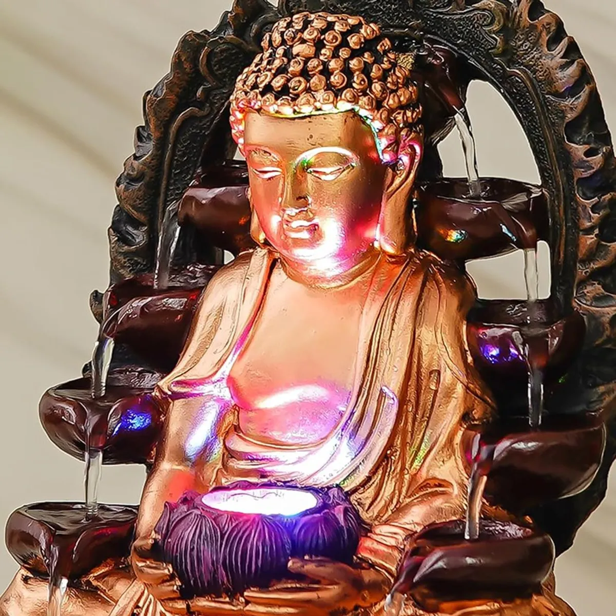 Close-up angled view of the Buddha LED fountain with flowing water