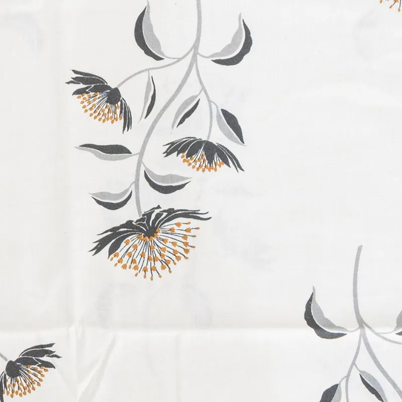 White bedsheet with delicate grey and mustard floral motif