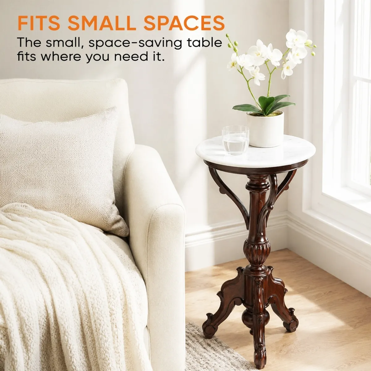 Compact round side table with white top placed beside an armchair