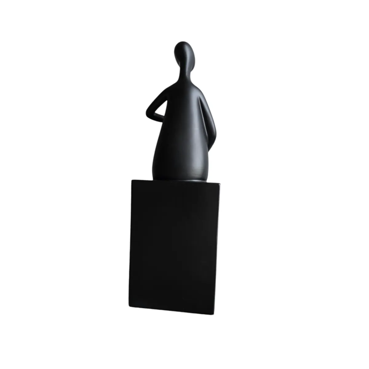 Rear view of the black abstract figurine on a rectangular base