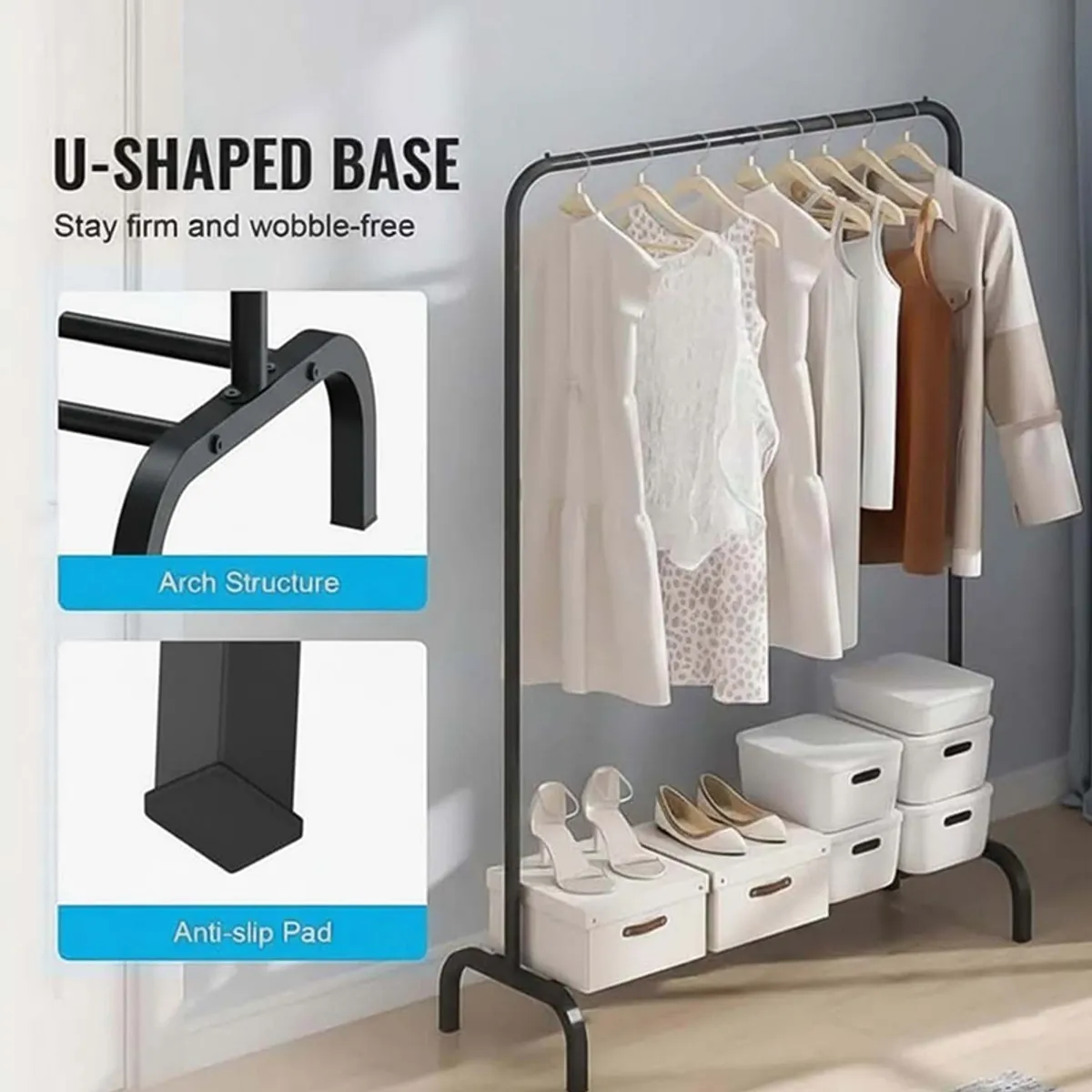 Black metal clothes rack showing curved base and lower rails