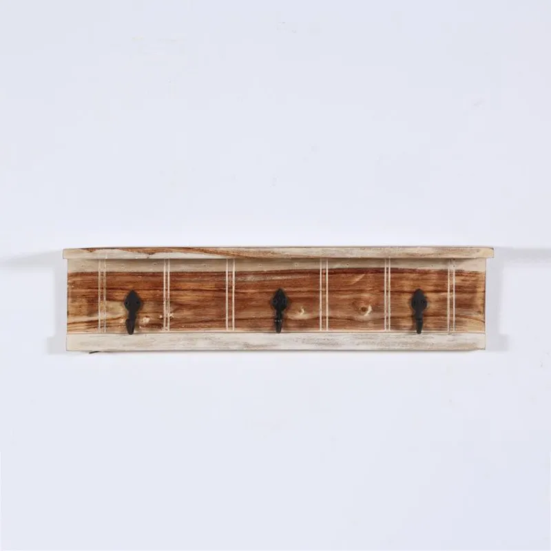 Front view of a wooden key holder with three black hooks and a slim top shelf