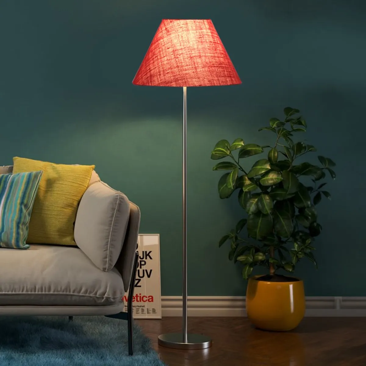 Lit rose blush floor lamp beside a sofa and potted plant