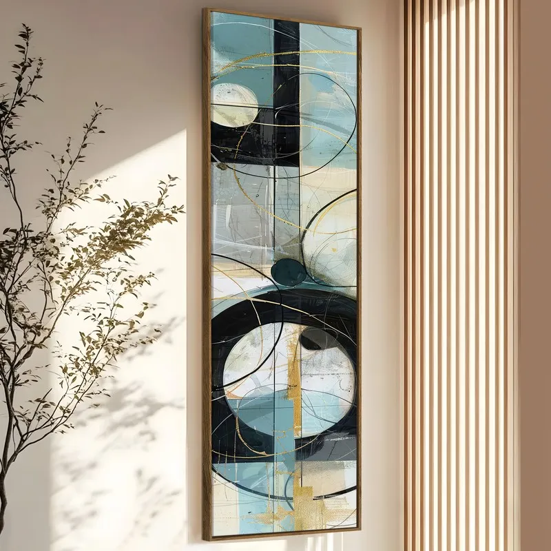 Tall framed abstract artwork in blue, black and gold styled on a neutral wall