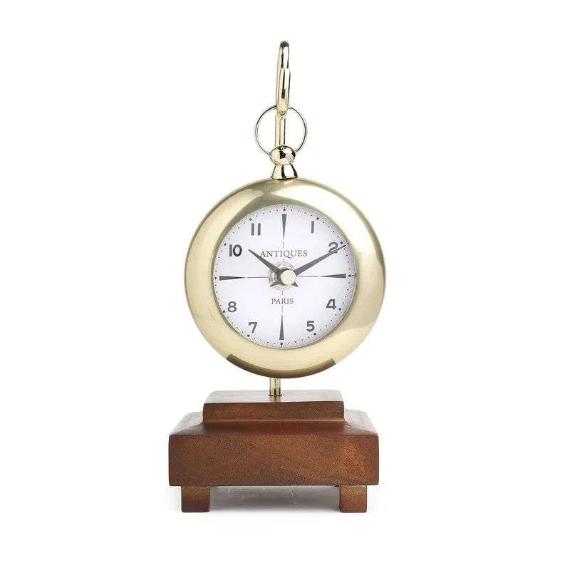 Front view of the gold table clock with white dial and wooden base