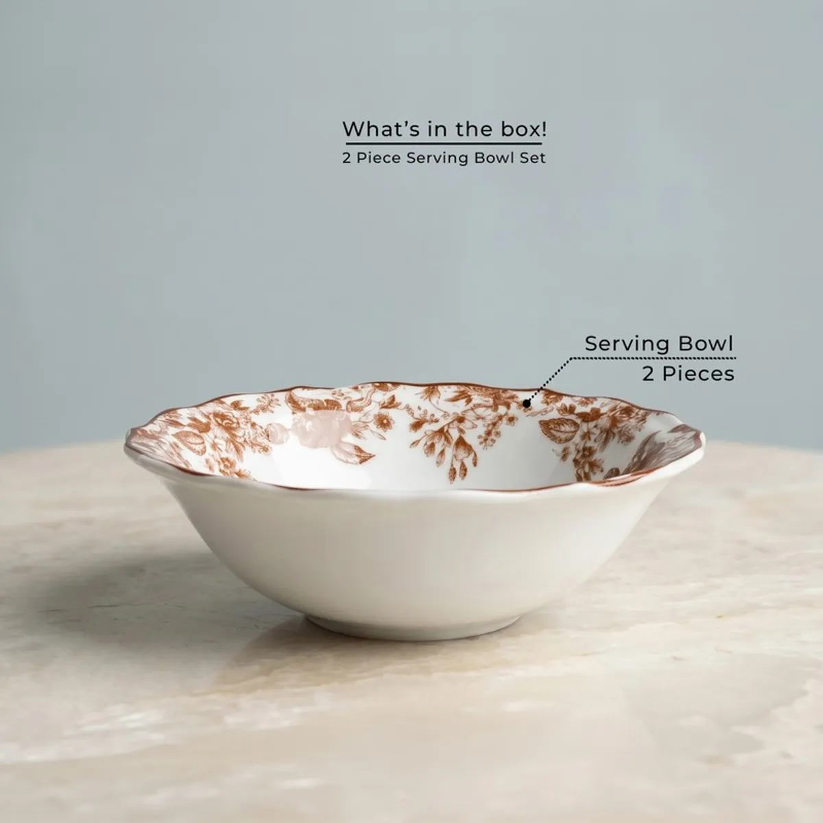Single white serving bowl with red floral detailing inside