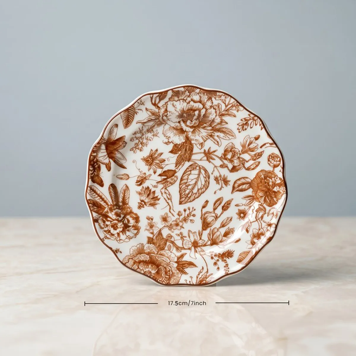 Single red and white floral quarter plate shown front on a tabletop