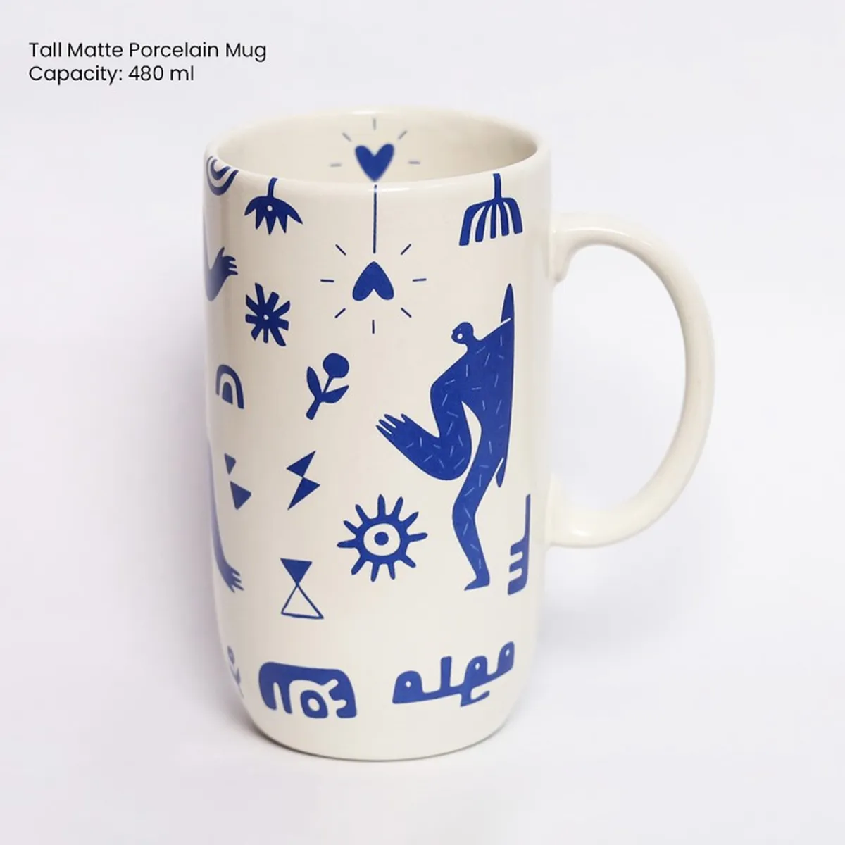 Front view of tall white mug with blue abstract figurative motifs