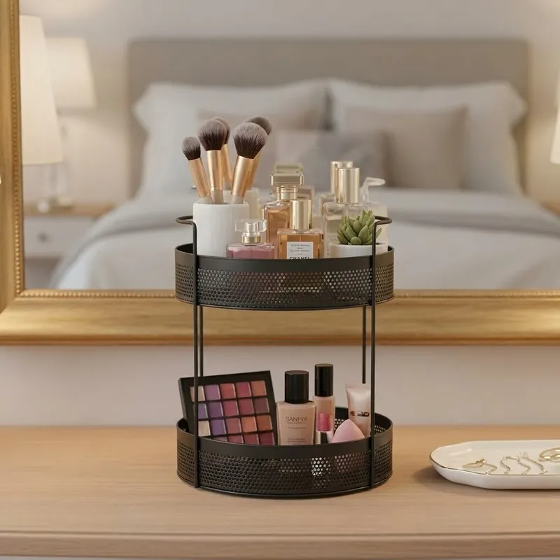 Black two-tier organiser arranged with makeup and beauty items on a vanity