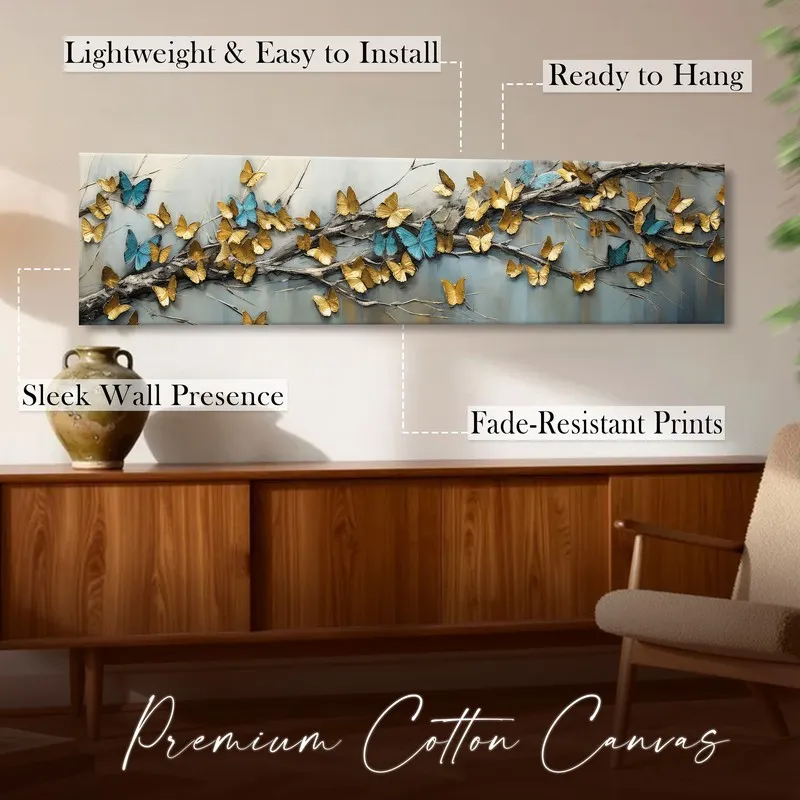 Butterfly canvas wall art styled above a wooden console in a warm room