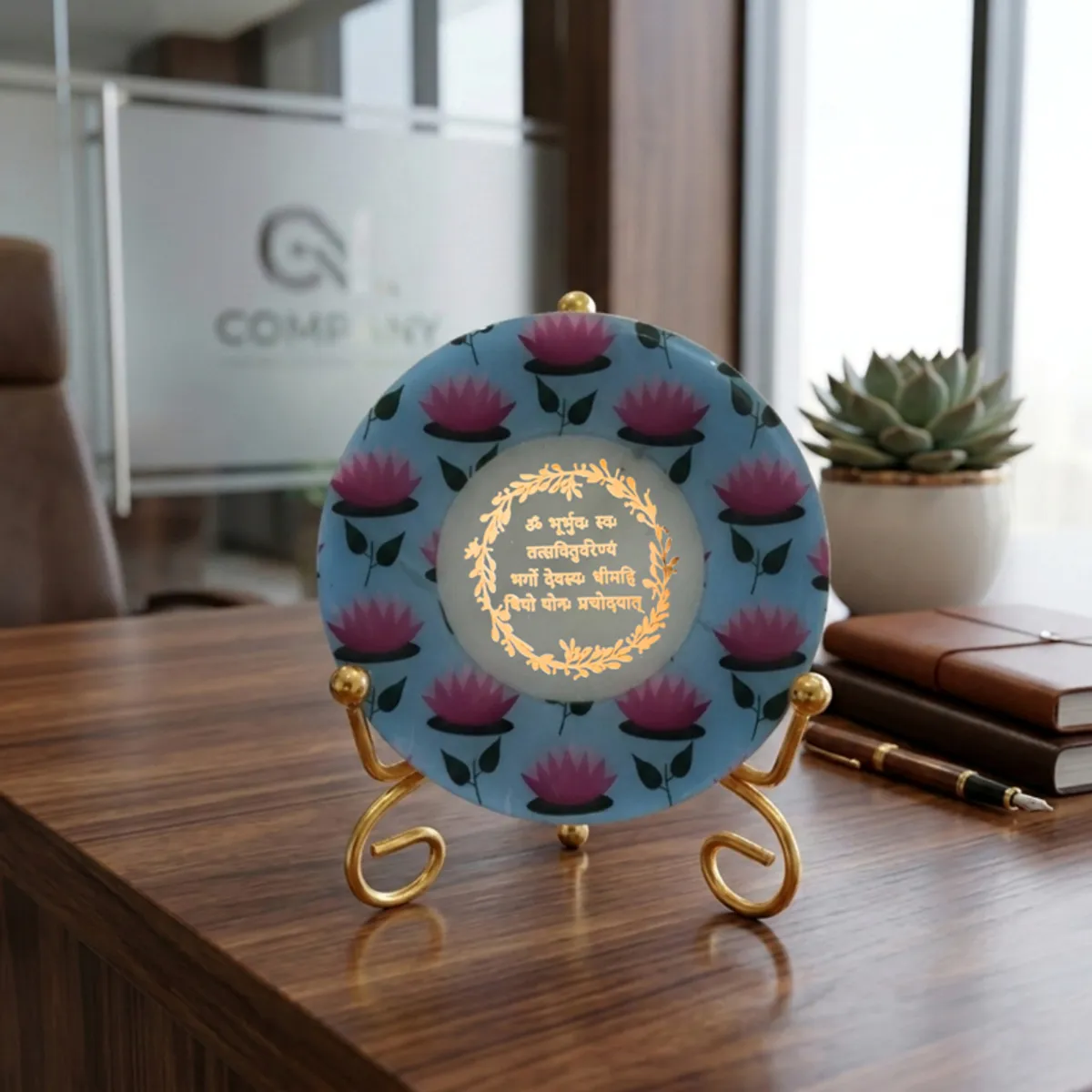 Lotus motif marble showpiece on a gold stand placed on an office desk