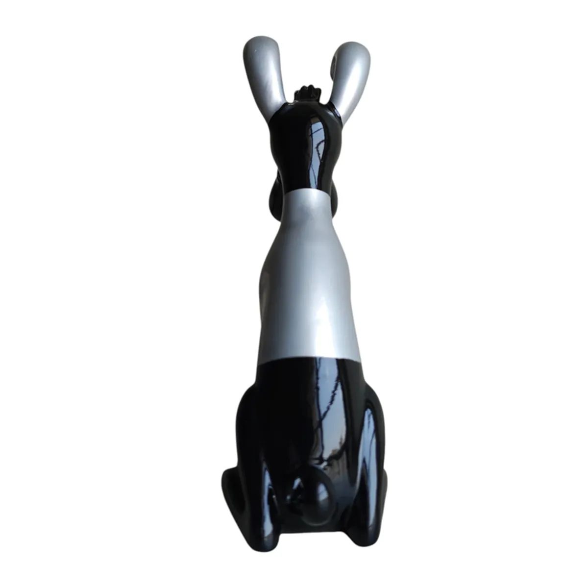 Rear view of the black and silver abstract dog sculpture
