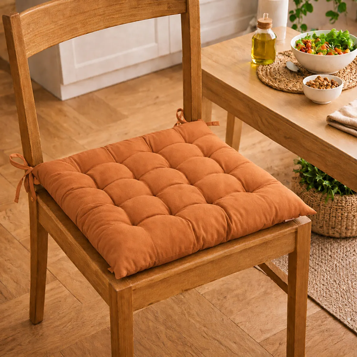 Brown tufted chair pad fitted on a wooden dining chair