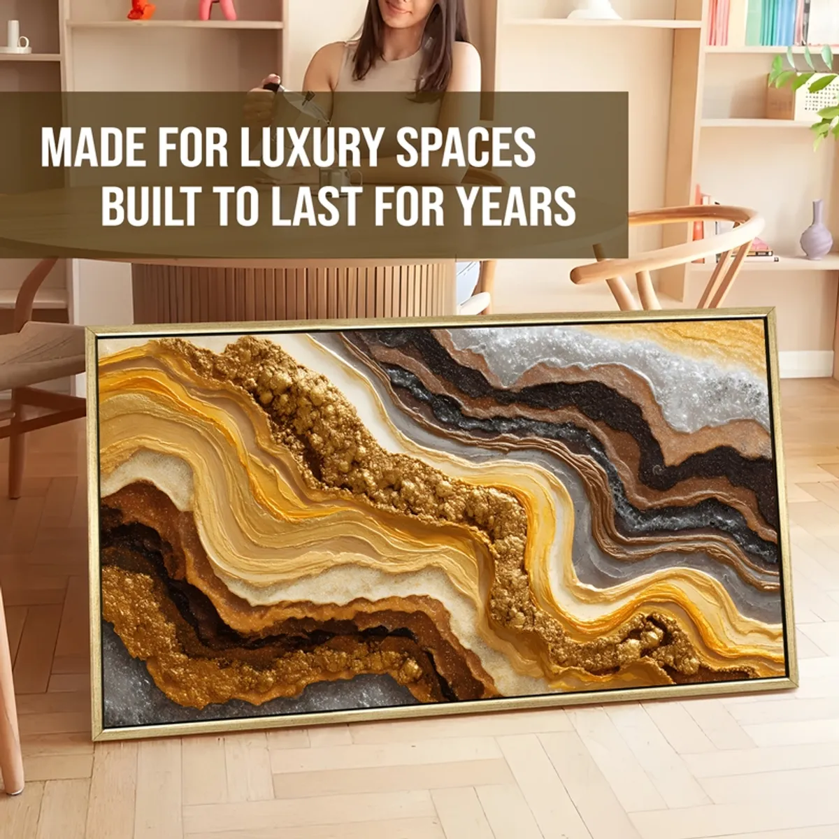 Large framed abstract geode painting leaning against a wall in a room setting