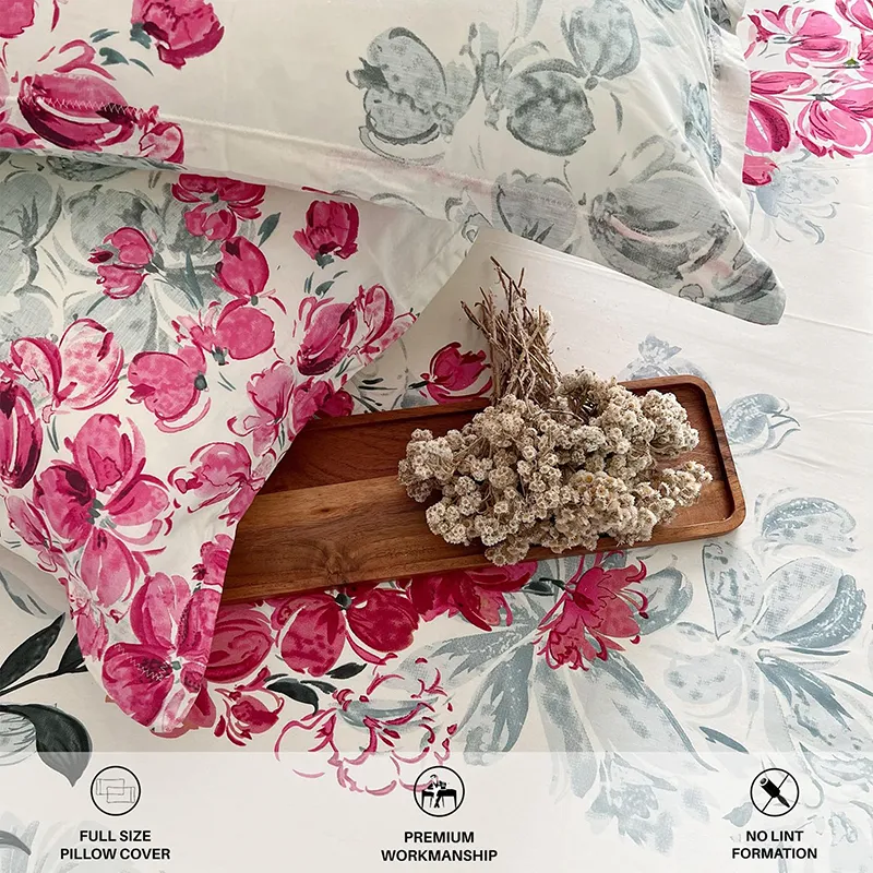 Close-up of pink floral bedding with matching pillow cover and tray