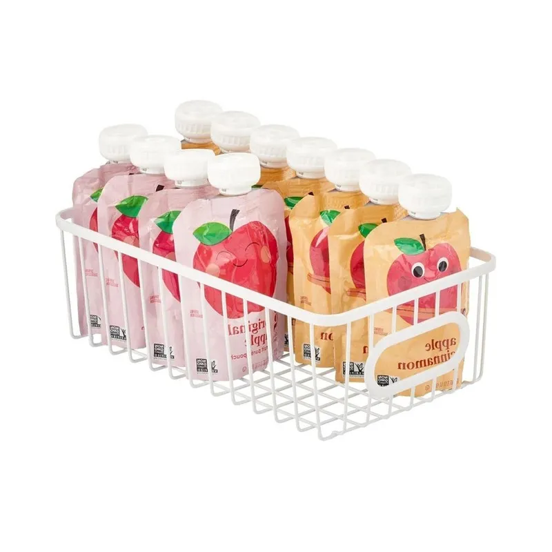 White metal basket filled with fruit puree pouches